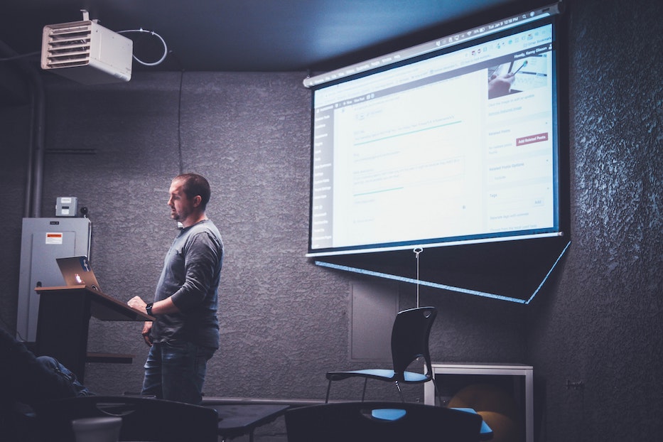 Person presenting at a corporate event